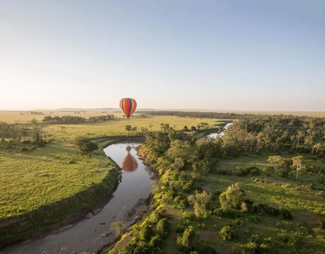 A hot air balloon over the Mara River of the Masai Mara National Reserve