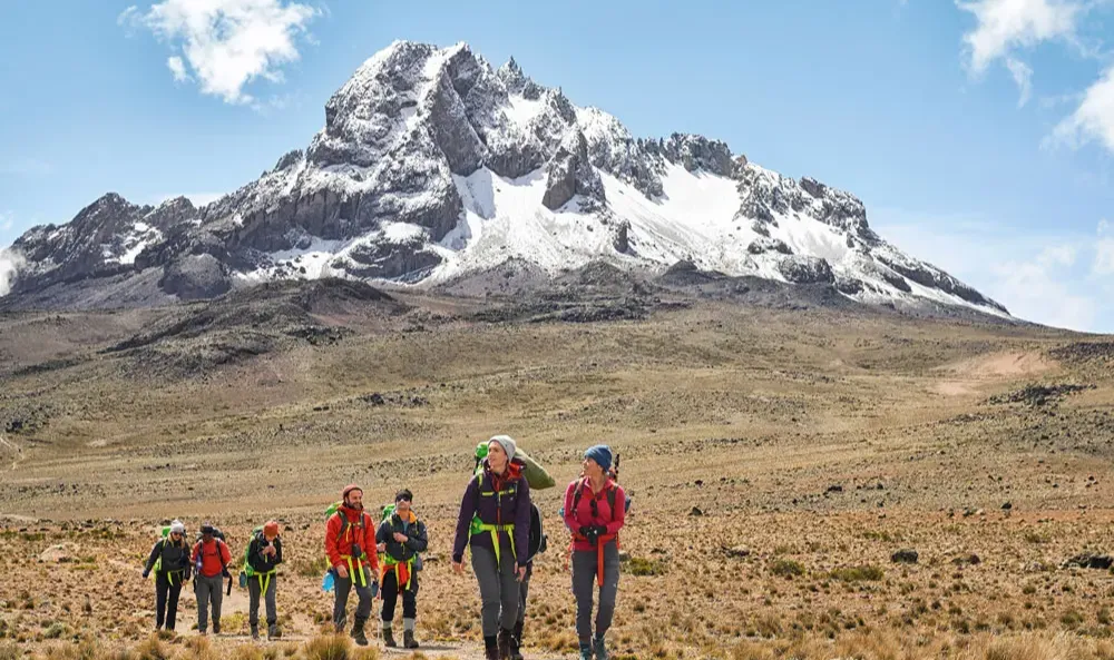 Mount Kenya peak with a group of hikers