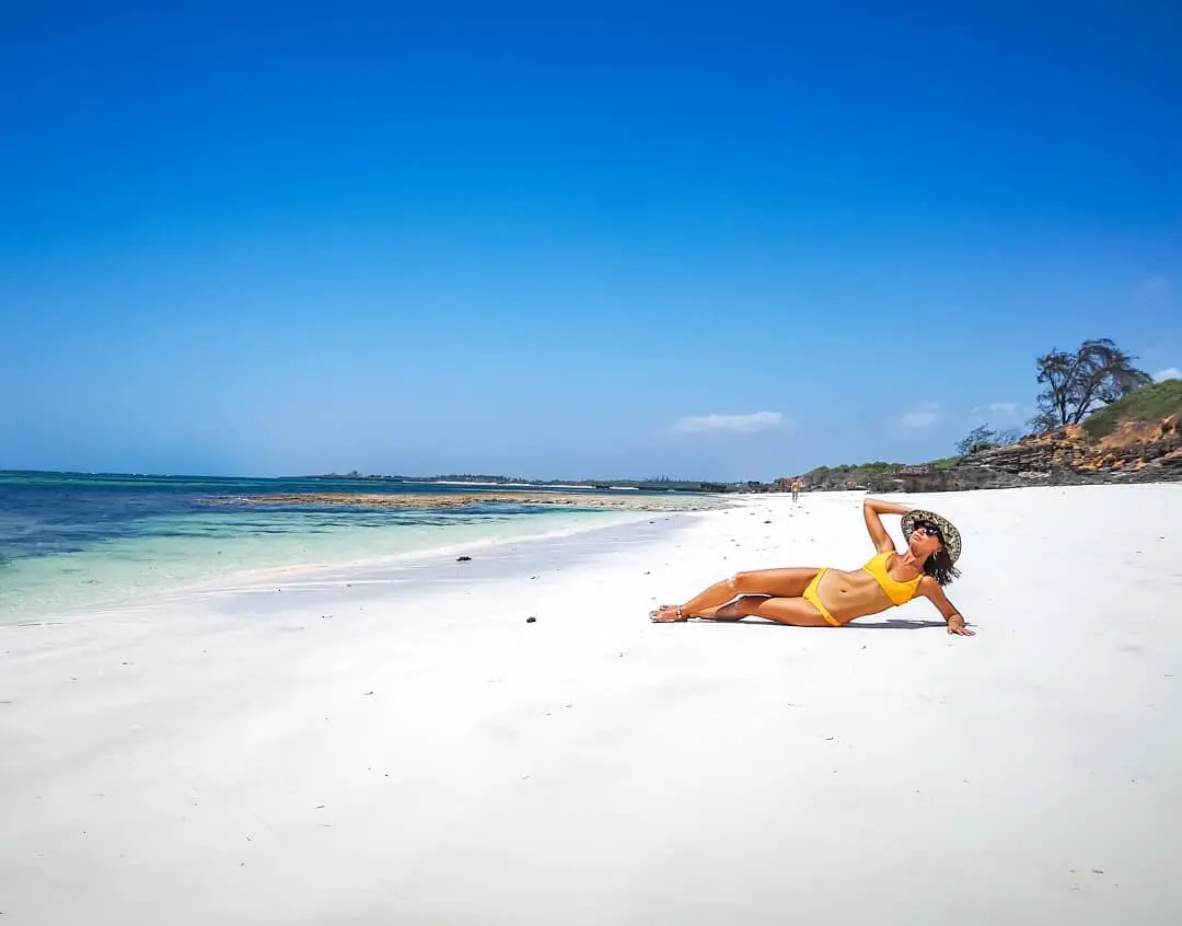 Watamu Marine park beach with visitor sunbathing